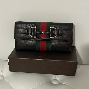Gucci women’s trifold wallet with classic web
